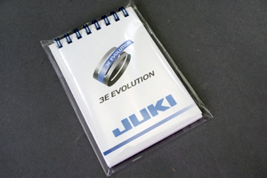 JUKI株式会社　様オリジナルノート 外装にも気を配り、高級感も演出する「OPP袋」